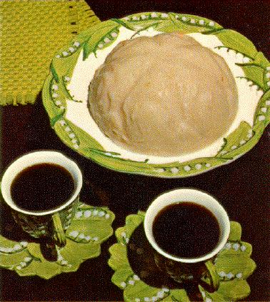 A greyish mound of something gelatinous-looking, and two 
cups of coffee